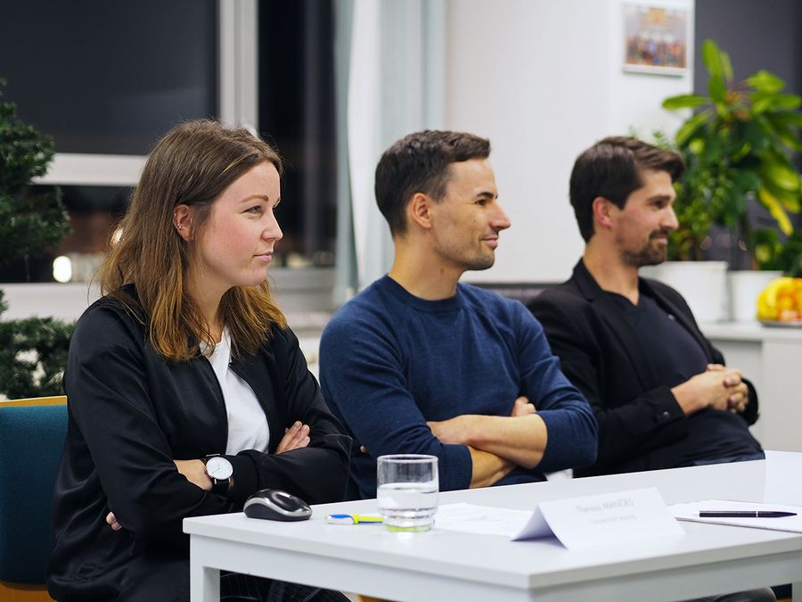 enlarge the image: you see three participants of our 2nd No2Doping project meeting, sitting at a table and listening, photo: Kristin Zumpe