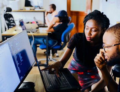 two students working together on the computer